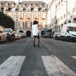 Travel girl walking in the street, "place des vosges" in paris. famous place in Paris.